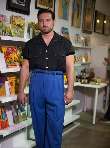 Hollywood Trousers styled in a vintage-inspired Indoor scene, worn by a man with a tapered fit, paired with classic menswear for a retro look.